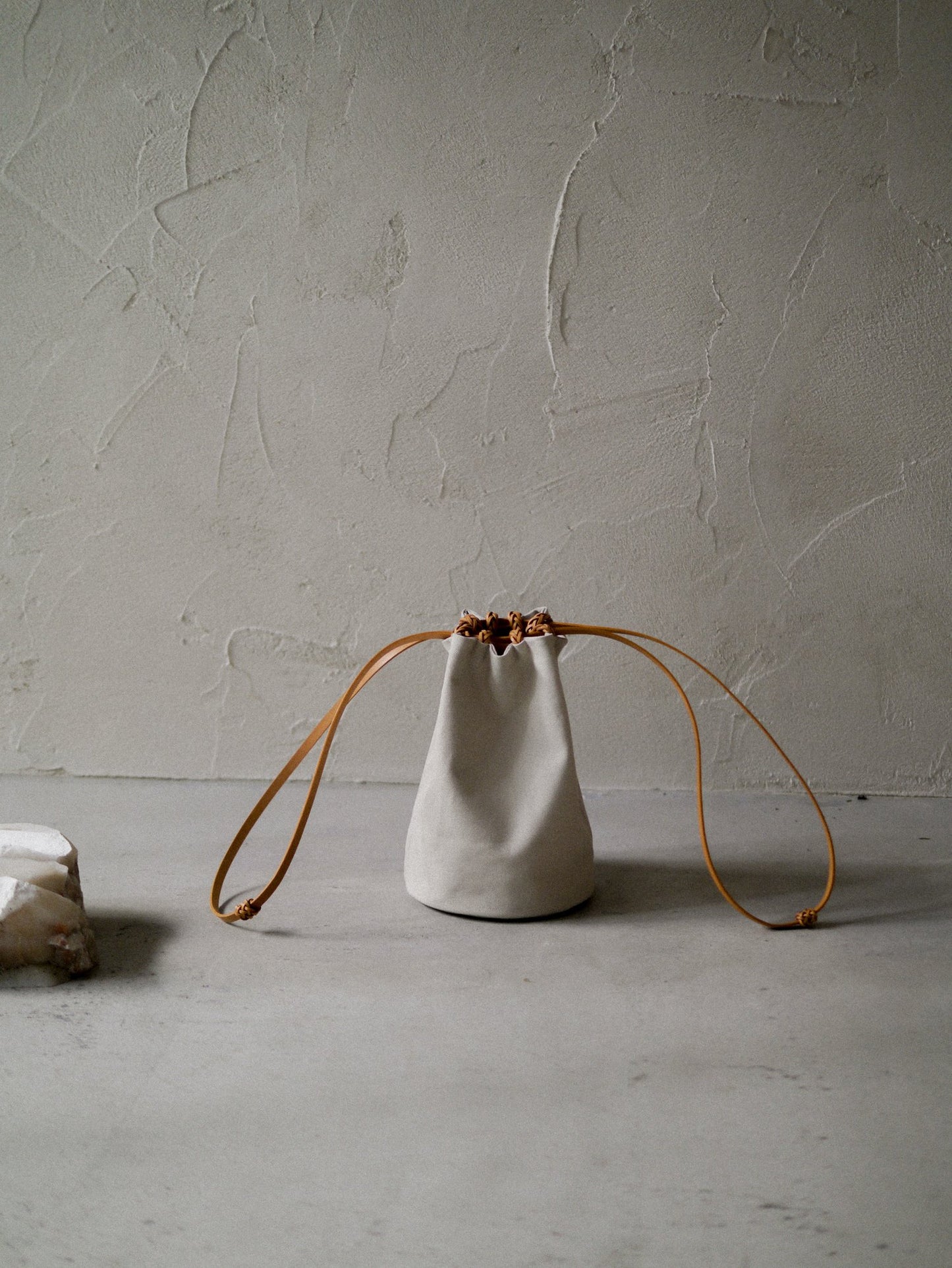 KAMARO'AN Woven Drawstring Bucket Bag